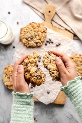 chocolate chip cookies with an human hand