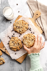 chocolate chip cookies with an human hand