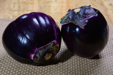 Fresh ripe sicilian purple globe Violetta eggplants vegetables ready to cook, healthy Italian food