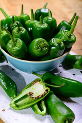 Fresh green mild padron pepper pementos, ready for grill or to be fried with olive oil, traditional snack in Galicia, Spain