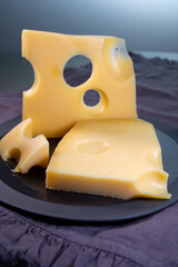 Swiss cheese collection, yellow emmentaler or emmental cheese with round holes