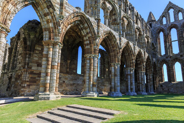 Fototapeta premium England, North Yorkshire, Whitby. North Sea, East cliff. English Heritage site, ruins of Benedictine abbey, Whitby Abbey, monastery.