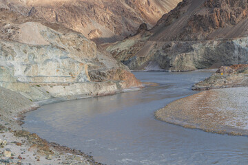 Fototapeta na wymiar the stream flows between the mountains at Turtuk village, Nubra Valley, Ladakh, India.
