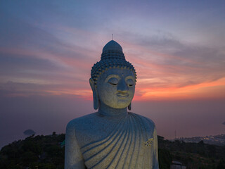 .aerial view Phuket big Buddha in beautiful sunset..aerial photography scenery light through sky in sunset at Phuket big Buddha. .Phuket Big Buddha is one of the island most important and revered  © Narong Niemhom