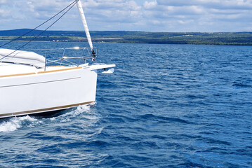 Sailboat sailing in the Mediterranean Sea at sunny summer day. Cruising luxury yacht. Vacation in...