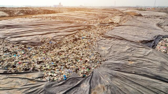 A landfill is a site for waste disposal where trash is buried in layers, and covered with soil. Proper management and monitoring are essential to prevent contamination of soil, water, and air.
