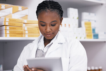 Black woman in pharmacy with tablet, online inventory list and prescription medicine on shelf....