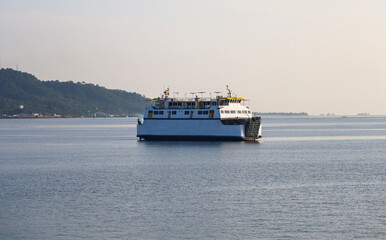 passenger ships at sea. Mountains in the background, ferry boat sailing in the bali strait, Indonesia