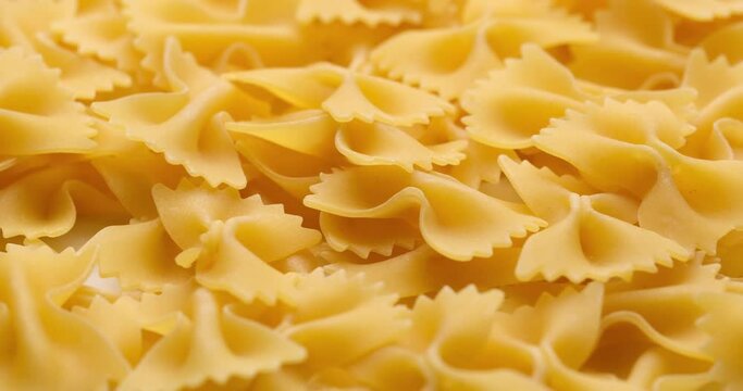 pasta backgroud - macro view of Dry Authentic Italian farfalle