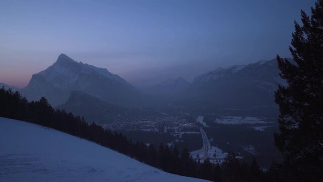 view on rundle mountain and city of banff during sunrise