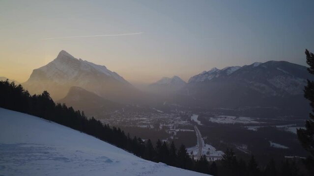 view on rundle mountain and city of banff during sunrise