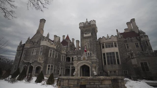 main entrance with fountain of Casa Loma castle style mansion and garden in midtown Toronto during winter