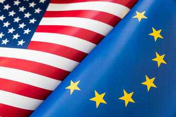 Background of the flags of the USA and European Union. The concept of interaction or counteraction between two countries. International relations. political negotiations. Sports competition.