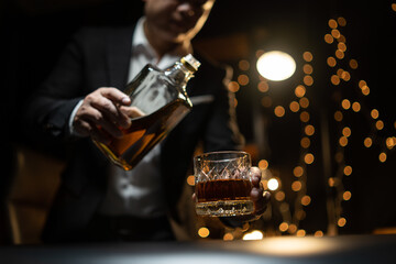 Barman pouring whiskey whiskey glass beautiful night
