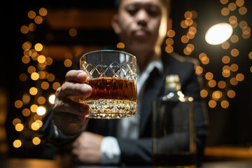 Barman pouring whiskey whiskey glass beautiful night