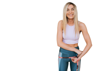 Pretty blonde American young woman in sportswear measuring  hips by measure tape looks at camera against transparent background.