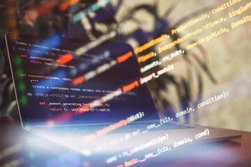 Programming code on the laptop screen. Notebook closeup.