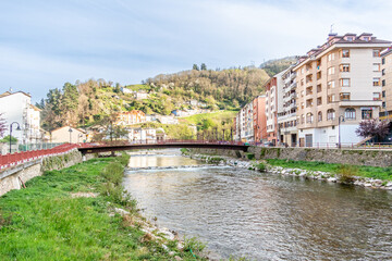 Fototapeta na wymiar Narcea river as it passes through the center of the city of Cangas del Narcea in Asturias, Spain