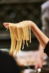 Delicious home made pasta in cooks hand