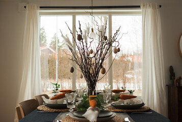 Easter dinner table decorated ready for a celebration meal