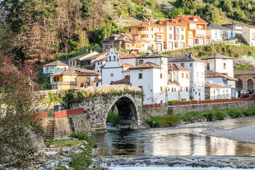 bridge of Roman origin on the Narcea river as it passes through the center of the city of Cangas del Narcea in Asturias, Spain