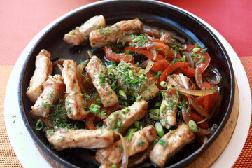 Fried pork pieces with vegetables