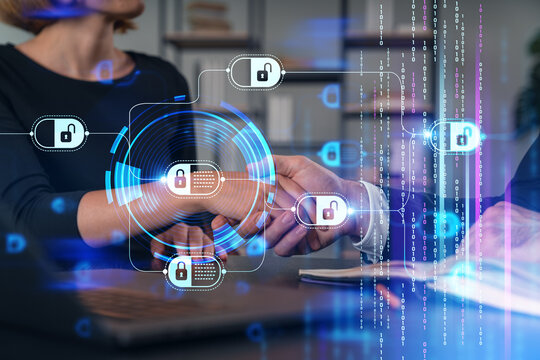 Businesspeople shake hands on great deal at office workplace. Concept of team work, business agreement, partnership, project success. Handshake shot. Blockchain hologram