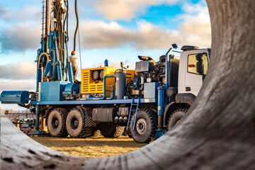 The drilling rig close up. Powerful drilling rig against a cloudy sky. Deep hole drilling....