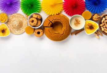 Festa Junina Summer Festival Carnival concept. Brazilian straw hat, popcorn, peanuts and Corn Cake on White Wooden Background