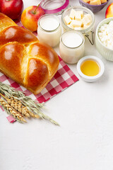 Jewish Shavuot Holiday Card. Dairy Products, Apples, Cheese, Bread, Milk on White Background.