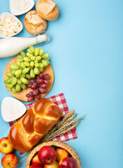 Naklejka na ściany i meble Jewish Shavuot Holiday Card. Dairy Products, Apples, Cheese, Grapes, Bread, Milk on Blue Background.