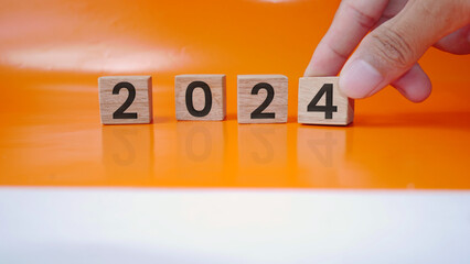 Wood carving with the inscription 2024. Merry Christmas and Happy New Year, Blue background. 2024...