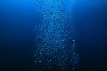 air bubbles underwater background diving in the sea