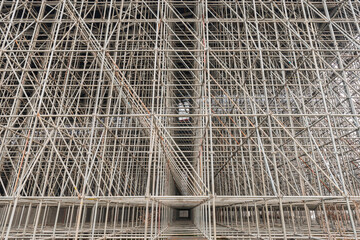 Vertical scaffolding formed a myriad of grid.