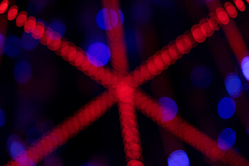 Red colored bokeh streaks reminding of the disco era