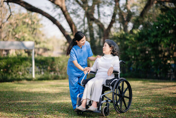 Asian young caregiver nurse support senior older male walking outdoors. Specialis doctor help and take care of elderly mature.