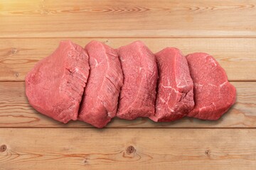 Tasty raw fresh meat on wooden board