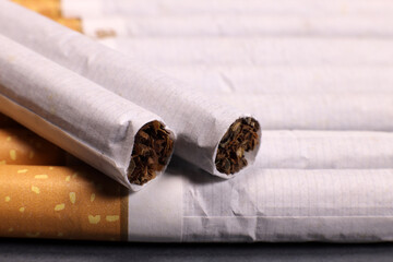Background of cigarettes on a gray background, the concept of cigarette products, the harm of smoking