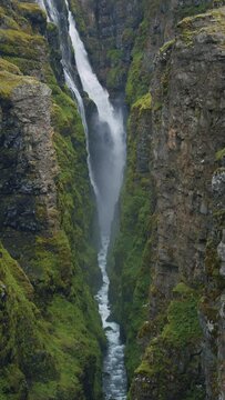 The second tallest Icelandic waterfall Glymur Majestic valley in Iceland, view of waterfall, rocks and stones Hvalfjordur Fjord