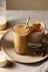 Glass of protein chocolate drink milkshake or coffee refreshing drink, moody lifestyle photo