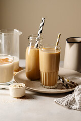 Glasses of protein chocolate drink milkshake or coffee refreshing drink, moody lifestyle photo