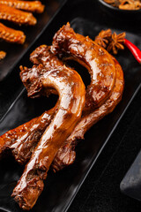 Delicious spiced duck neck on a plate
