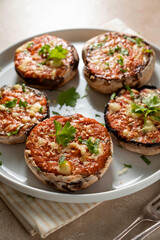 Stuffed champignon portobello stuffed with tomatoes sauce and cheese. 