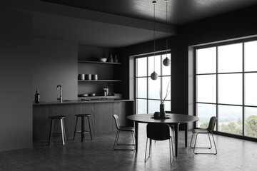 Gray kitchen corner with island and table