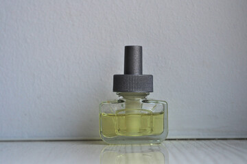 Sampler of women's perfume on a white wall background