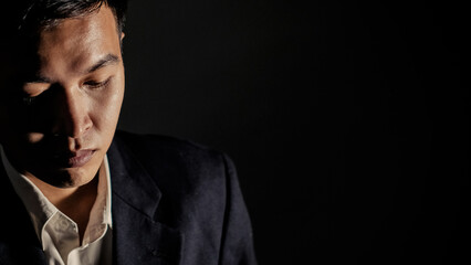 Businessman posing looking at the camera in the studio.