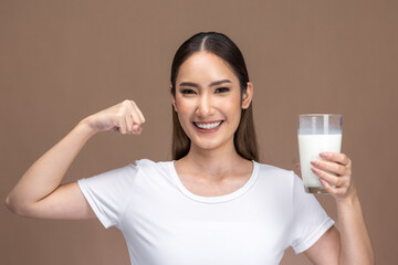 Asian beauty woman  cute girl feel happy drinking milk for good health Happiness  on Beige background.