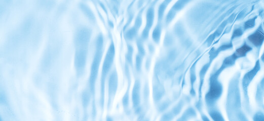 Background waves on the surface of the water on the sand.