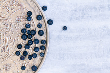 Fresh raw blueberries. Overhead, top view or above view composition with copy space..