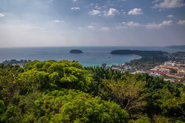 Fototapeta premium Beautiful beach with colorful water. Top view of the beautiful coastline. Sunny summer day. Colorful water. Sandy beach.
